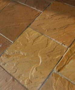 Square slabs of golden brown sandstone laid in patio